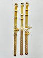 Pulseras doradas con dijes